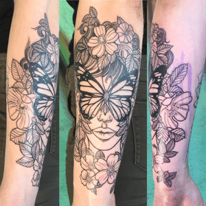 Illustraive black work girlhead with butterfly and flowers on the back side of forearm 
