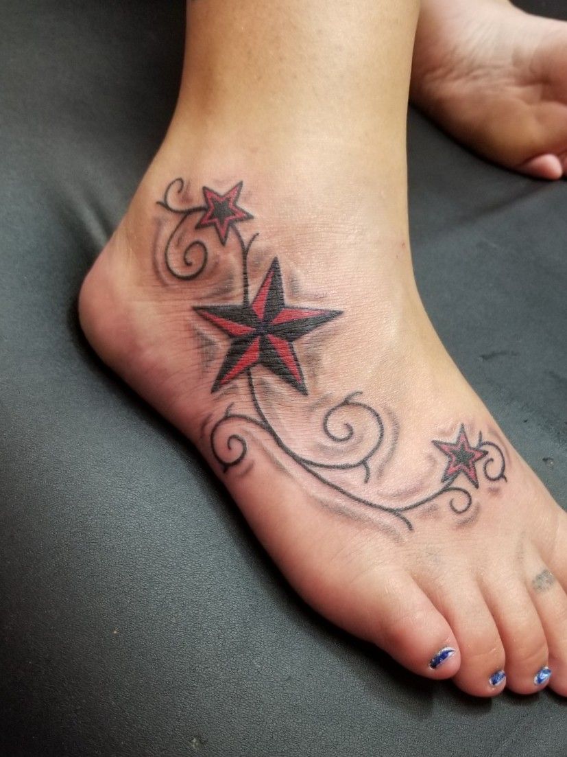 small star tattoos on foot