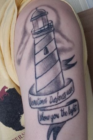 My first tattoo, A reminder of the where I have been, "sometimes the darkness can show you the light," and a reminder of where I'm going the light house, ever reaching for what's possible and always shining no matter what life throws at you always bounce back and be a light for others.