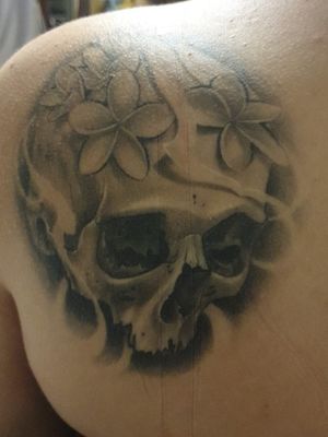 Skull with FrangipanisBy Troy Slack Sashiko Tattoo studio (formely known as Front Yard tattoos)