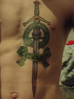 My family crest done on my chest its my first tat and i love it 