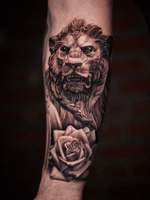 Lion and rose on arm.