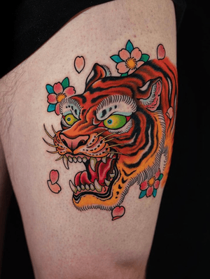 Tiger on and cherry blossoms on the thigh.