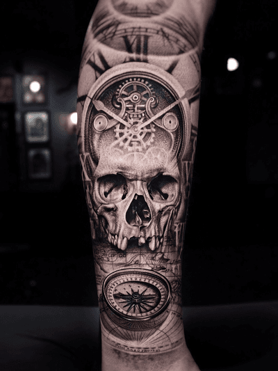 Skull and time piece on leg.