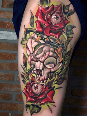 Skull and roses on leg.