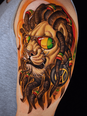 Reggae lion on arm.