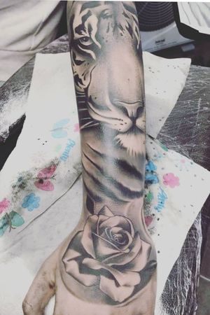 Realistic tiger with a realistic rose sleeve 