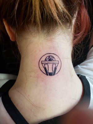 Tomorrowland logo pin tattoo
