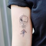 Symbol tattoo by Tattooist Dal #TattooistDal #symboltattoo #symboltattoos #symbol #symbols #tattooswithmeaning #meaningfultattoo #dreamcatcher #moon #feathers #fineline 
