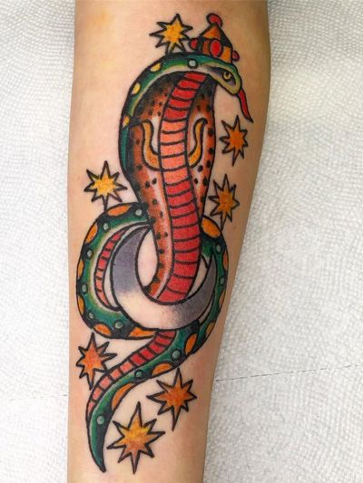 Symbol tattoo by Robert Ryan #RobertRyan #symboltattoo #symboltattoos #symbol #symbols #tattooswithmeaning #meaningfultattoo #cobra #Moon #stars #traditional