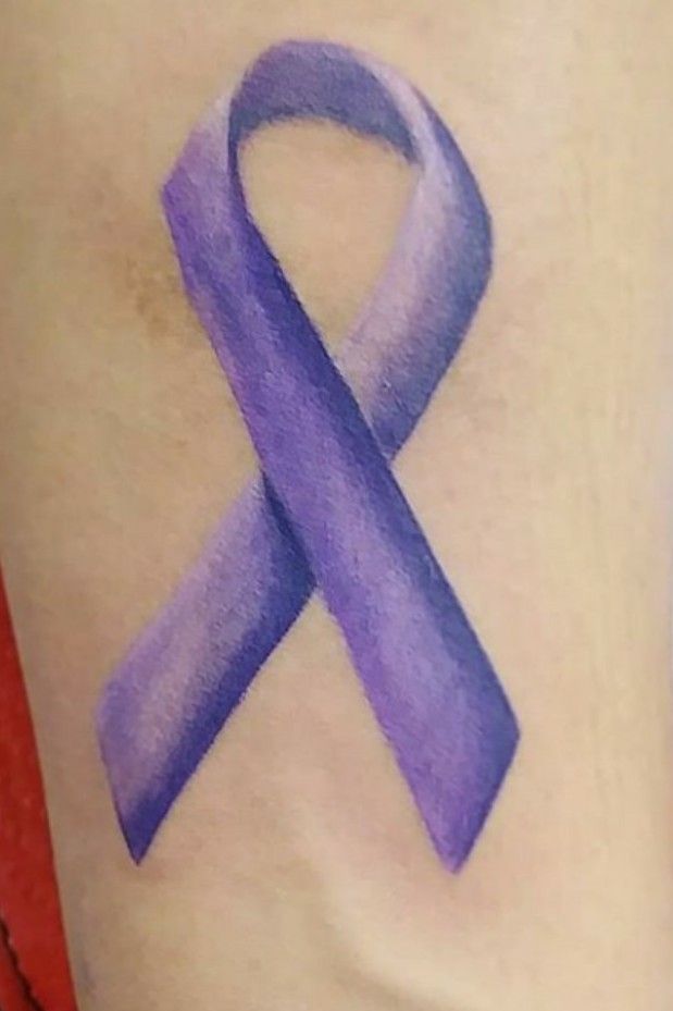 a purple ribbon tattooTikTok Search