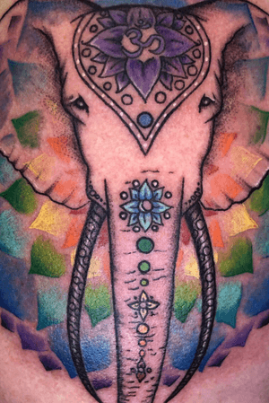 Elephant tattoo - the true spirit of the elephant, color background and trunk art to represent the chakaras, translucent ears to give a ghost feeling. #elephant #elephanttattoo #energy #psychic #spiritual #spiritualtattoo 