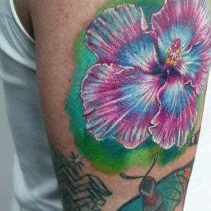 Flower and butterfly tattoo. #realistic #colortattoo #tat2holics 