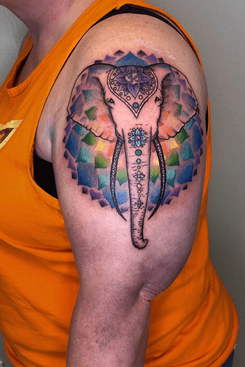 Tattoo uploaded by Holly Hunt • Elephant tattoo - the true spirit of the elephant, color background and trunk art to represent the chakaras, translucent ears to give a ghost feeling. #elephant #