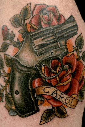 Hand gun and roses 
