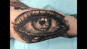 Realistic eye tattoo! Love some dark black and gray work!!