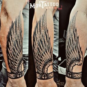 #wingstattoo #wing #arm #cross #bracelettattoo #bracelet #feathers #blackandgreytattoo 