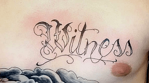 Black and grey lettering, “Witness”