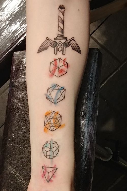 A dice sword with a couple other nerdy elements in it. Got it done in Ireland.