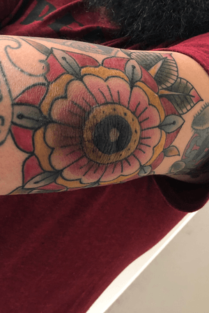 American traditional flower on my elbow by Alex Avalos at Wolf Street tattoo