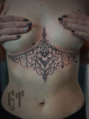 Done by Gorilla Tattoo#linework #underboob #mandala #lotus #flower 