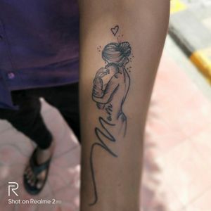 mom and son tattoo done by kiran thakur at think tattoos