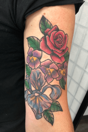 Joe’s first tattoo! #floral #biflag #color #rose #violets #iris #ladytattoer #queer 
