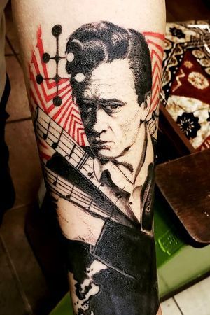 Homage to Johnny Cash done in trash polka style with stipple dotwork technique portrait. Front inner forearm.