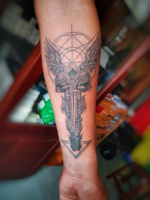 My mates sailor tattoo on his forearm, the colour work is