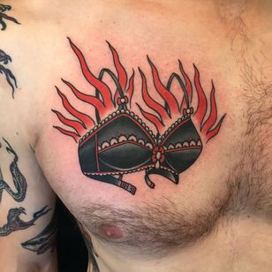 Burning bra tattoo por Holly Ellis #HollyEllis #femaleempowerment #intersectionalfeminism #womxn #feministtattoo #badasstattoos #cooltattoos #riotgrrl #girlpower #grlpwr #burningbra #bra #fire #traditional #chesttattoo 