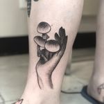 Illustrative tattoo by Tina Poe #TinaPoe #MoonTattooStudio #AustinTexas #Austin #Texas #tattooartist #illustrative #linework #fineline #dotwork #sketch #hand #mushrooms #lowerleg #calf