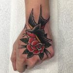 Rose and swallow hand tattoo