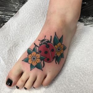 Lady bird and traditional flowers