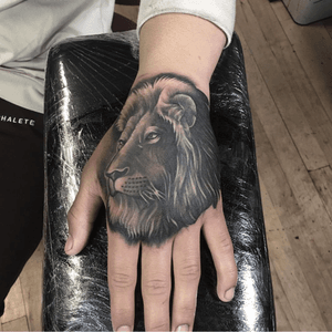 Lion tattoo on hand