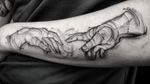 Experience the delicate detail of Elisa Thirteen's fine line masterpiece, capturing the moment of a divine touch on your forearm.