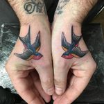 Swallow thumb tattoos