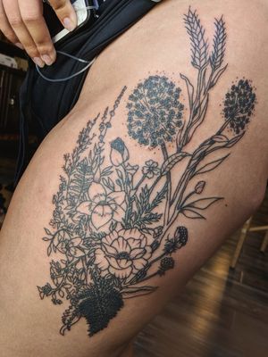 A lovely flower thigh tattoo
