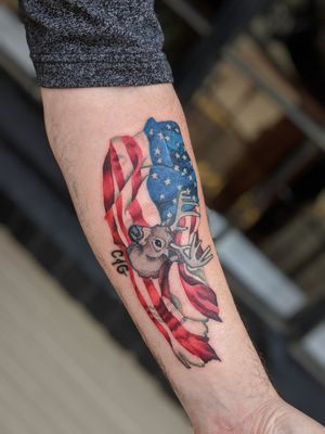 A cool deer and flag tattoo!