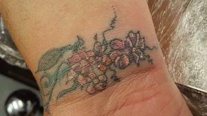 This was a cover up for a bold lettered name of her ex. She was told it couldn't be covered up. I used part of the name to create the lines of the vine and flowers. She went away a very happy lady. "At last". She said "it's gone". 