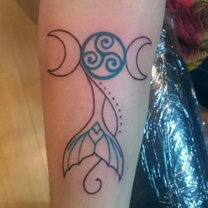 A tattoo I designed and drew for my wife, to capture her love of Celtic culture (the triskele), the moon (tri-moon symbol), and the ocean (mermaid tail). Tattooed by Jared at Standard Electric Tattooing in Lawrence, KS #mermaid #tri-moon #pagan #triskele #celtic