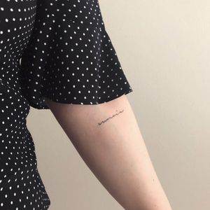 Healed text tattoo
