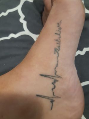 This tatt is a heart beat with the words.."just live" This tattoo symbolizes life, love, passion, power, strength, endurance, persistence, and the ability to keep on moving forward regardless the mountains or troubles ahead or behind. While simply in design, themeanings associated with the heart beat line in atattoo design are quite personal and complicated