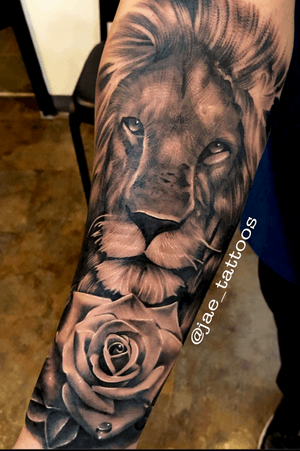 Black and Grey Lion and Rose by Jae_Tattoos at Tsunami Tattoo in Tacoma, Washington. 