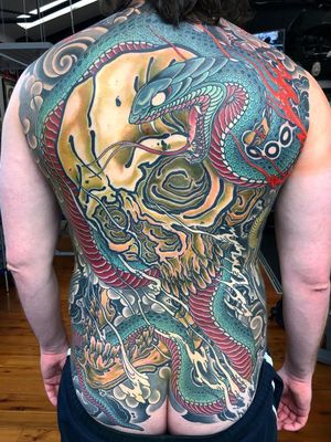 Neo Japanese tattoo by RYan Ussher #RyanUssher #back #backpiece #neojapanese #neojapanesetattoo #japanese #Japaneseinspired #ukiyoe #mashup #unique #skull #snake #color #fire