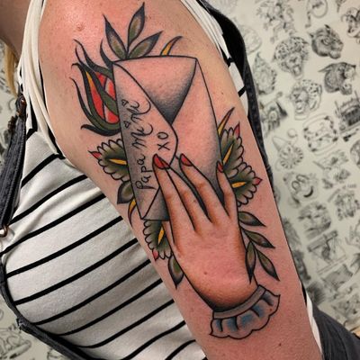 Tattoo of a hand by Kyle Hath #KyleHath #upperarm #arm #bicep #tattoosofhands #tattoohand #handtattoo #hands #fingers #traditional #color #letter #envelope #letter #flower #floral #leaves