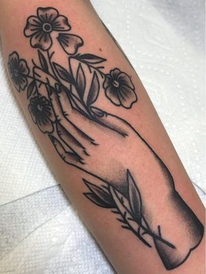 Tattoo of a hand by Beau Brady #BeauBrady #forearm #tattoosofhands #tattoohand #handtattoo #hands #fingers #blackwork #traditional #flower #floral