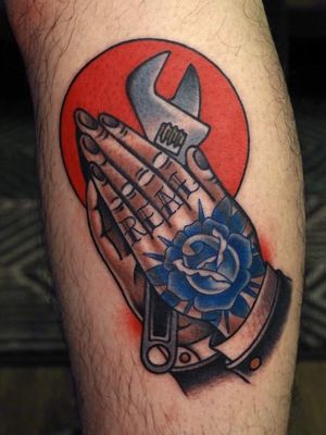 Tattoo of a hand by #Mick Gore #MickGore #lowerleg #calf #tattoosofhands #tattoohand #handtattoo #hands #fingers #clappers #prayinghands #rose #real #lettering #oldenglish #wrench #traditional #color