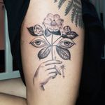 Tattoo of a hand by Ana and Camille #AnaandCamille #upperleg #thigh #leg #tattoosofhands #tattoohand #handtattoo #hands #fingers #blackandgrey #illustrative #flowers #floral #eyes #tears #magnolia