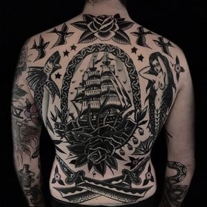 Nautical back tattoo collection by Austin Maples #AustinMaples #NauticalTattoos #sailortattoos #sailors #traditionaltattoos #traditional #AmericanTraditional #backpiece #nautical #ship #mermaid #fish #rose #sword #swallow