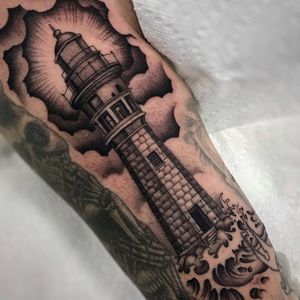 Lighthouse tattoo by Shaun Topper #ShaunTopper #NauticalTattoos #sailortattoos #sailors #traditionaltattoos #traditional #AmericanTraditional #nautical #lighthouse #upperarm #arm #bicep